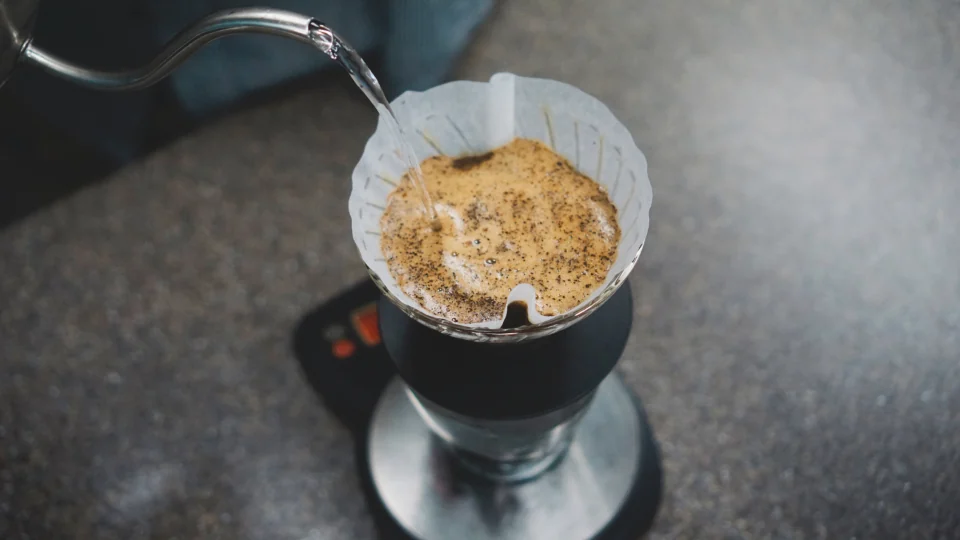 Coffee being poured into a cup