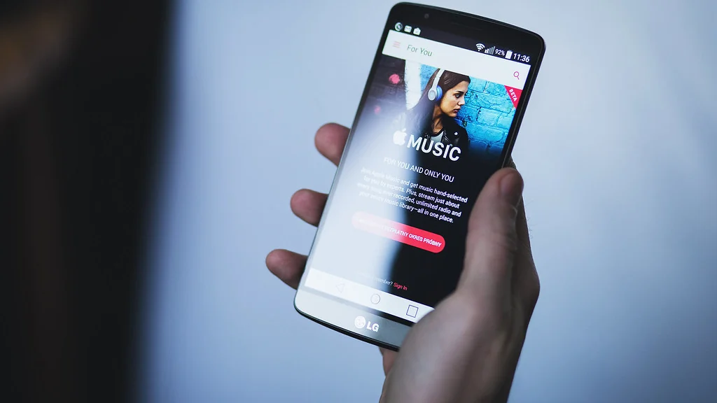Hand holding a phone running an app, the only controller a smart home without a hub needs