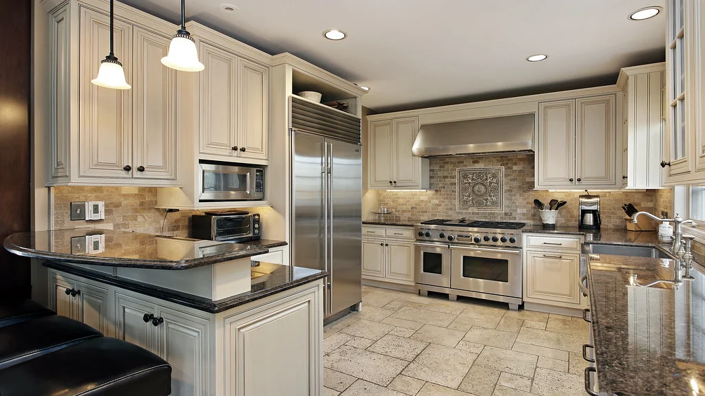 Kitchen with counters, cabinets and appliances