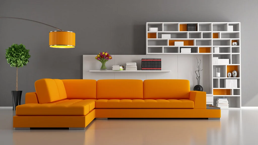 Living room with an orange sofa, shelves and several lamps