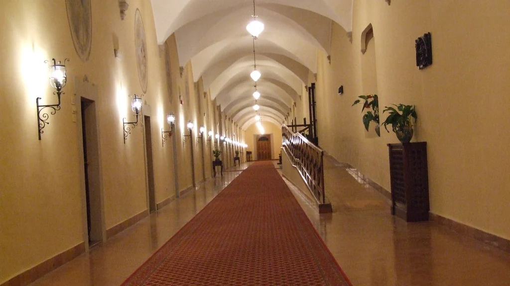 Long lit corridor running through a building