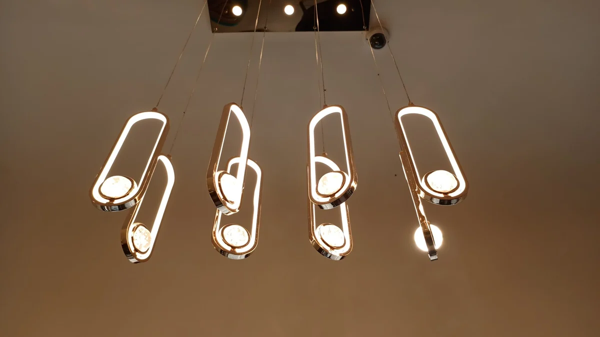 Modern pendant lights above a dark surface