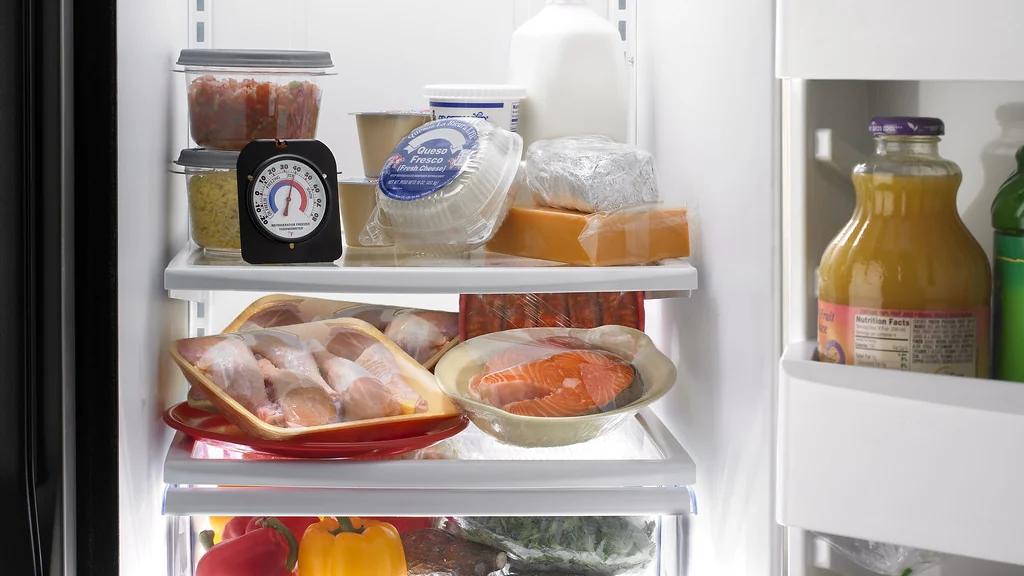 Open refrigerator stocked with food, an appliance that should stay on a normal outlet