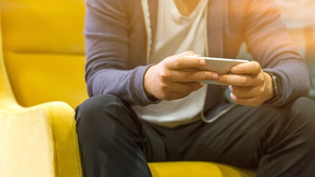 Person using a phone app while sitting down