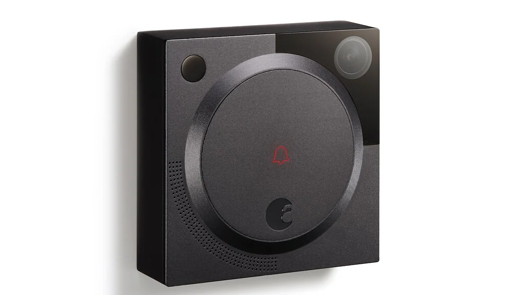 Plain black doorbell button on a white background