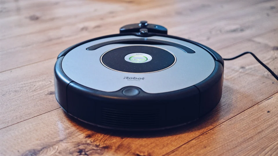 Robot vacuum cleaning a wooden floor