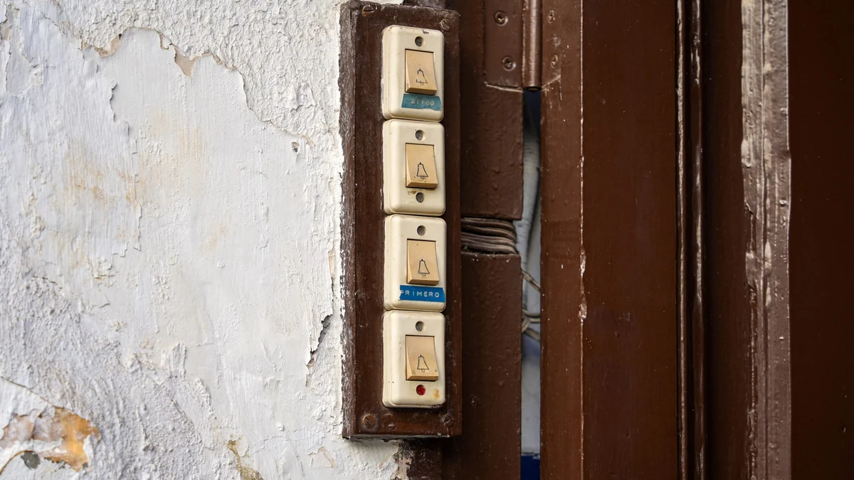 Row of old electrical sockets mounted on a wall