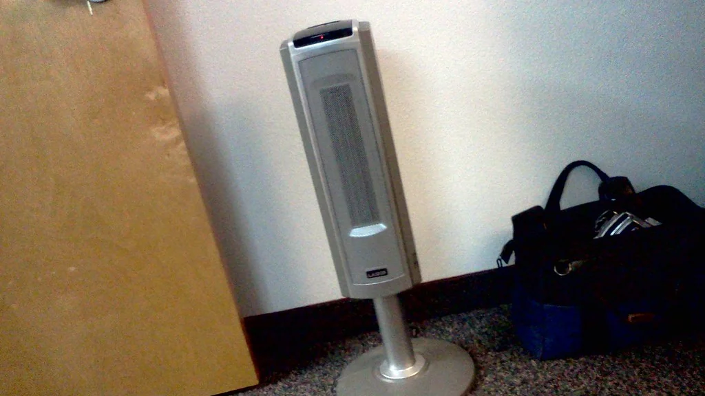 What Not to Plug Into a Smart Plug: 8 Essential Rules Tower space heater in a room, a clear example of what not to plug into a smart plug